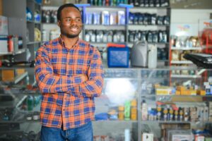 Home 47 smiling african salesman auto parts store